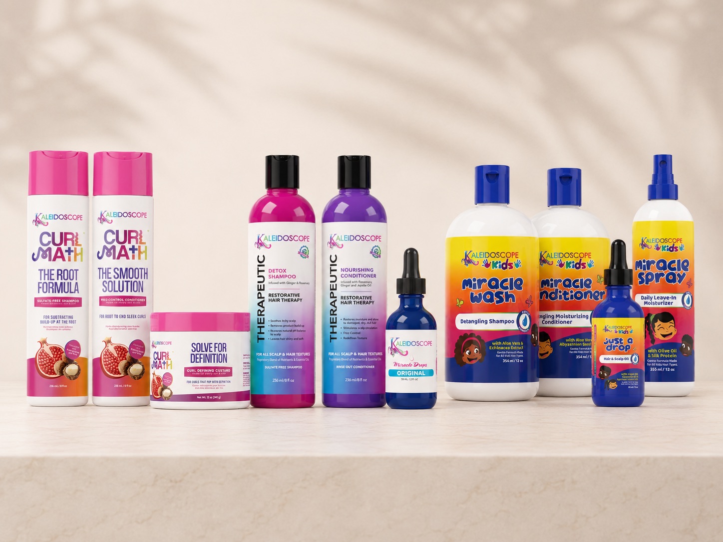 Kaleidoscope Hair Products review — Miracle Drops, Curl Math, Therapeutic, and Kids products arranged together