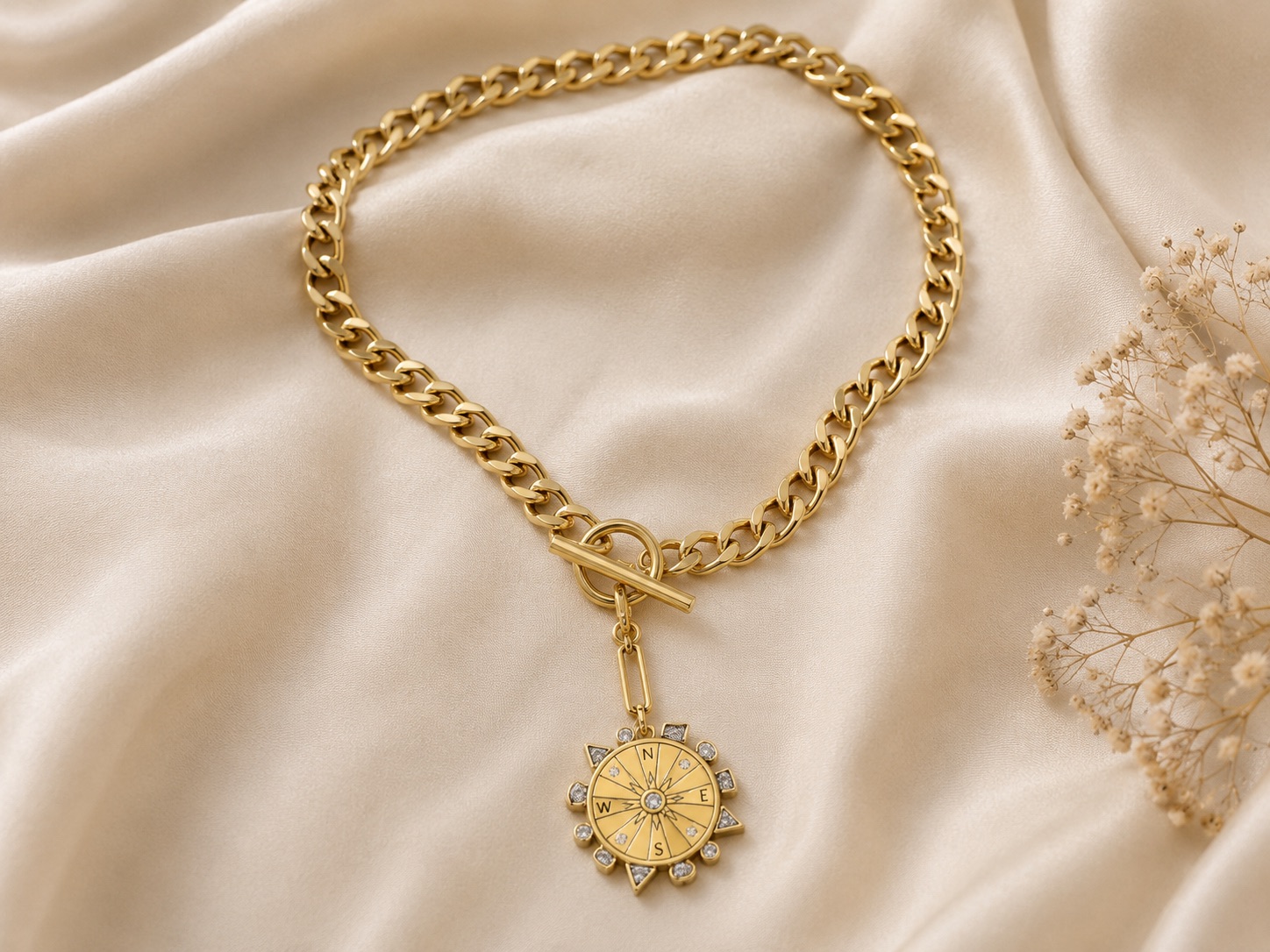Mignonne Gavigan Odyssey Necklace Blue Gold showing the front with a pale blue carved globe pendant and the reverse with a gold compass detail on a chunky gold chain
