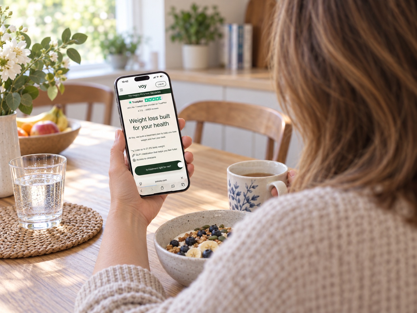 Voy weight management service shown through an app, progress tracking and clinician support without medication imagery